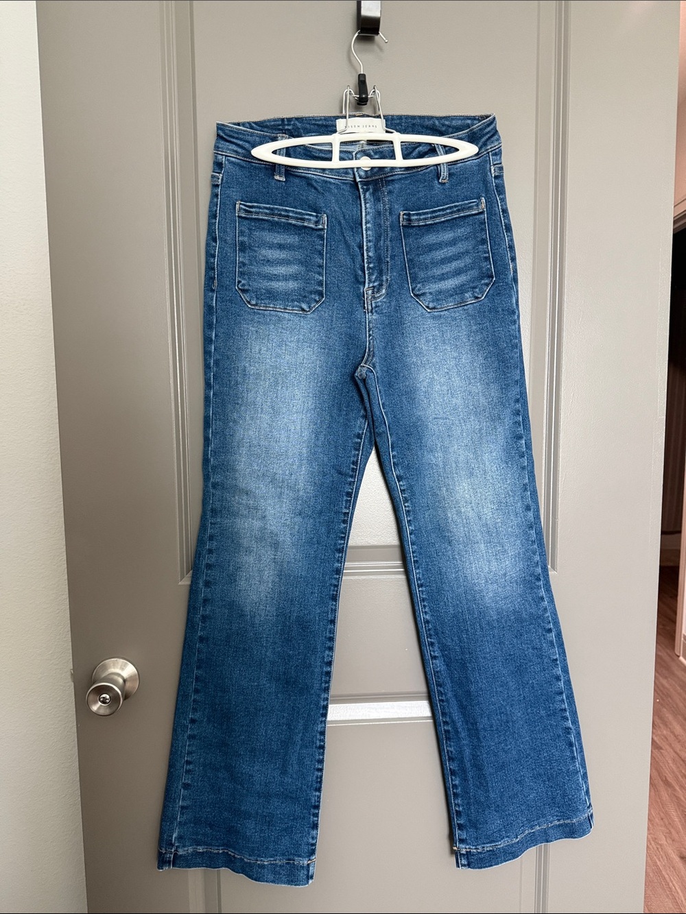 High-Rise Blue Flare Risen Jeans with Patch Pockets